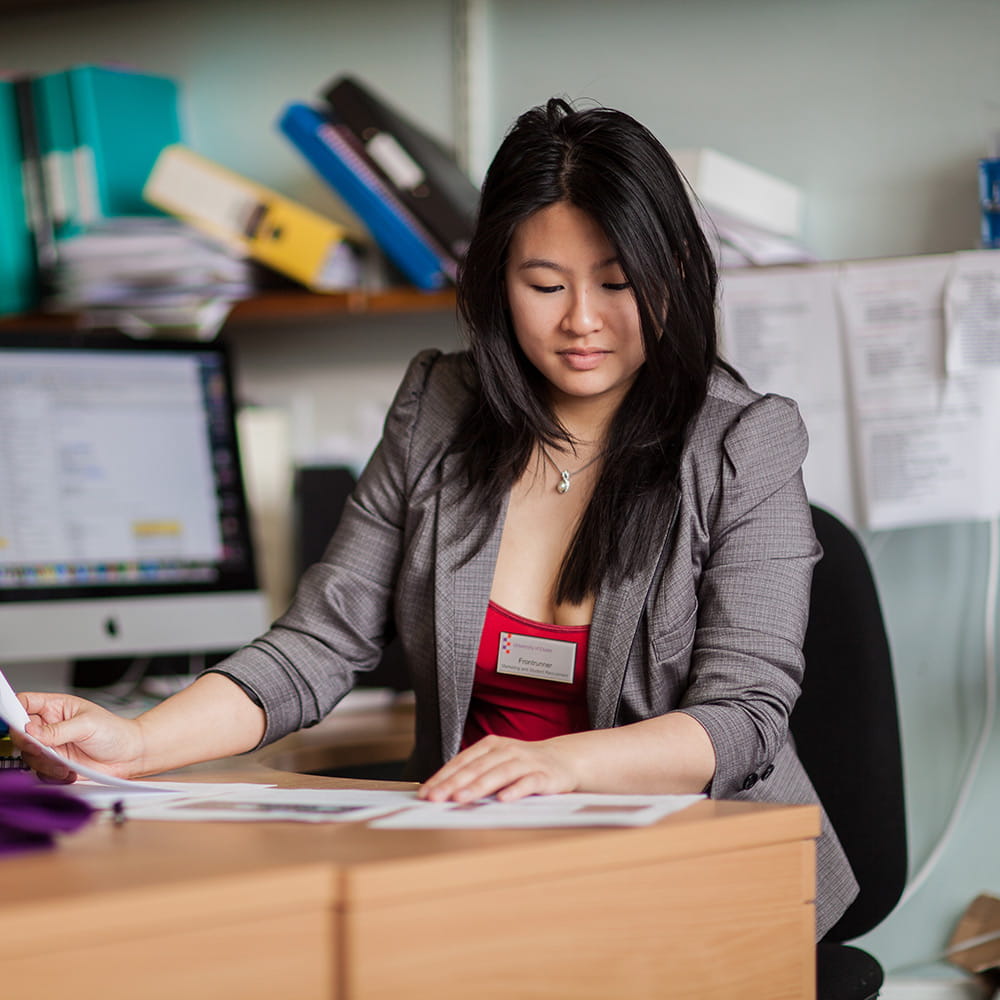 Careers adviser looking at paper work