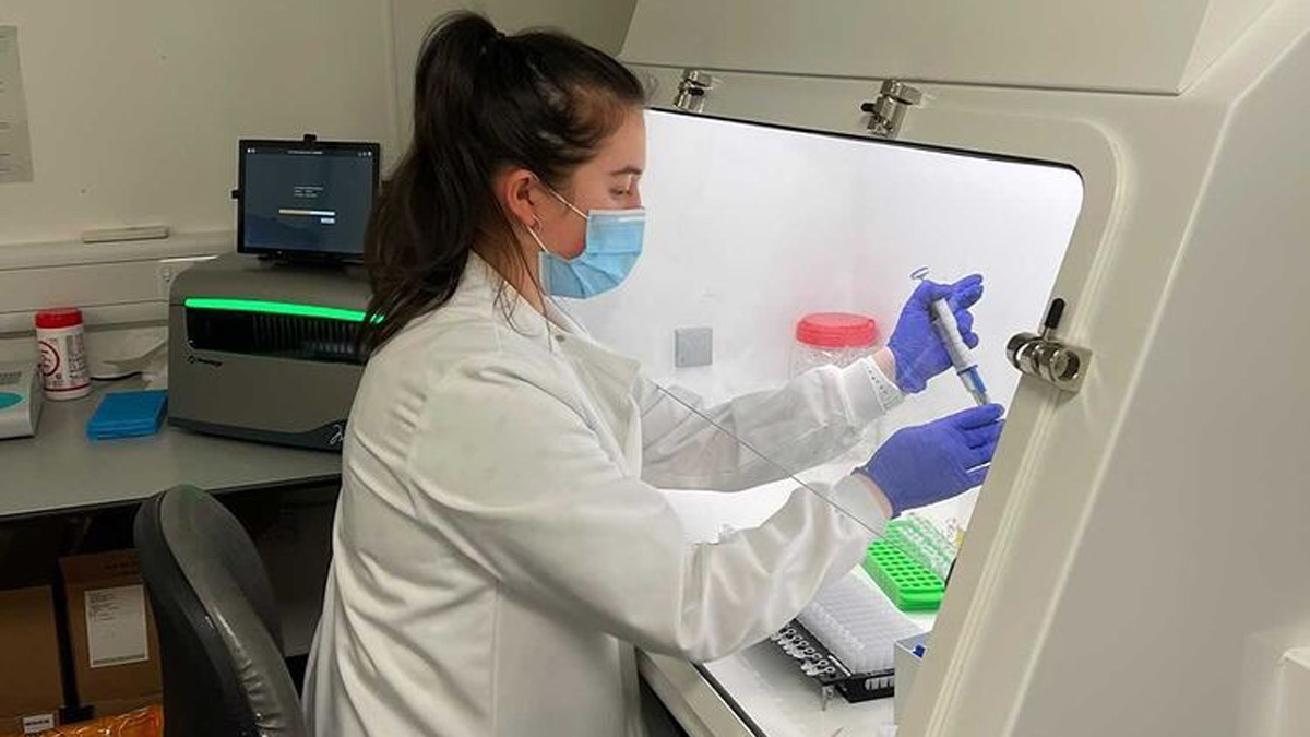 Alice Green working in a lab)