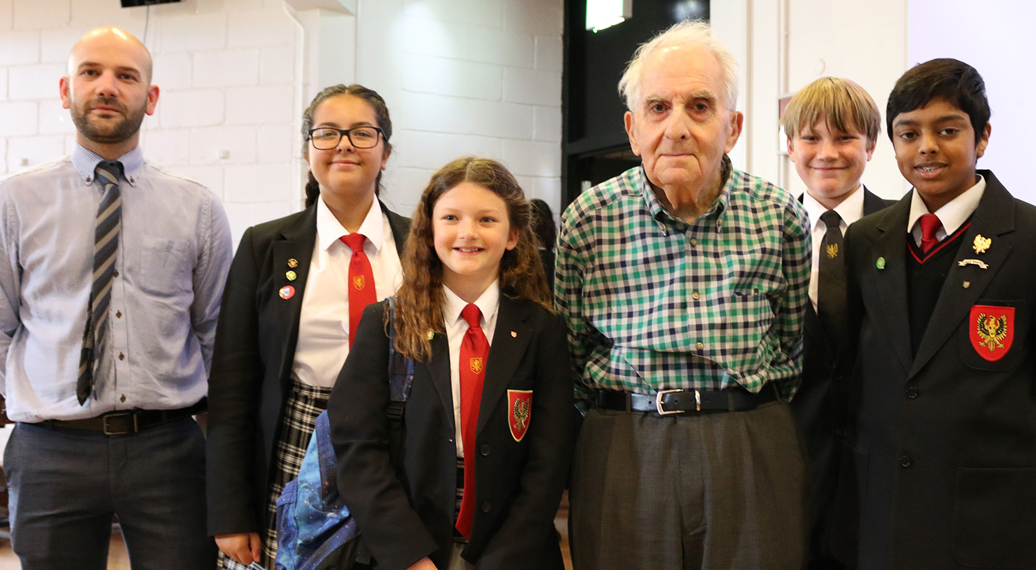 Holocaust survivor Frank Bright with students from The Gilberd School