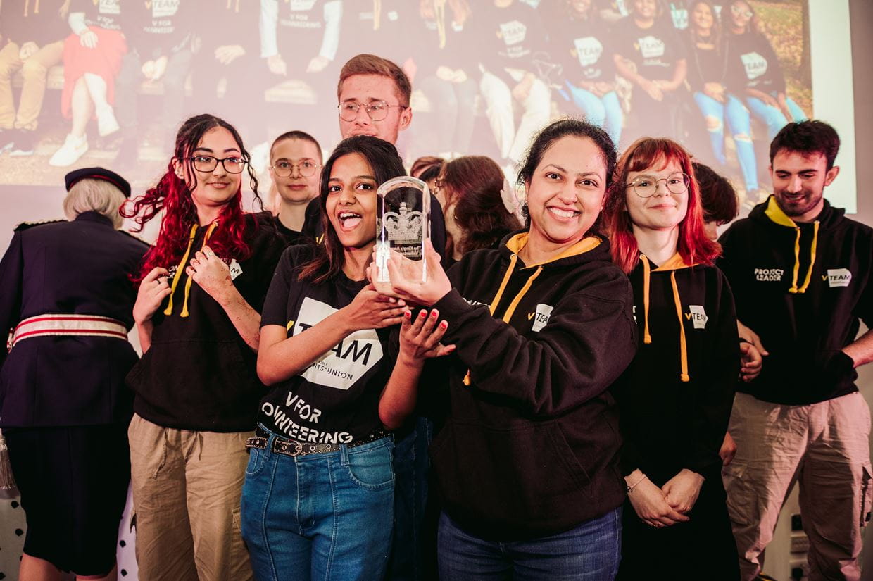 Students celebrate receiving the King's Award for Volunteering