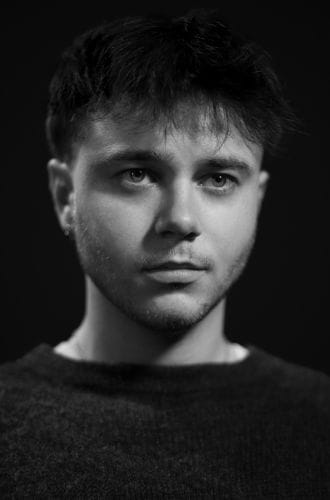 Filmmaker Marty Pritchard, photographed in a dark, moody way.