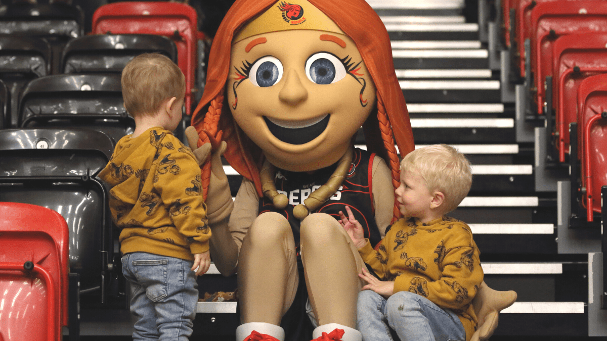 Essex Rebels mascot Queen B with children)