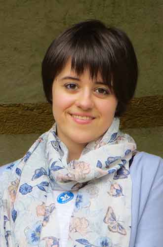 Sarah Lawrence, wearing a pastel-coloured scarf