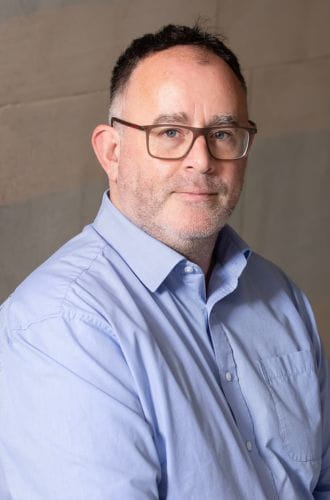 Professor Shane Martin, wearing a cool coloured shirt, looking relaxed