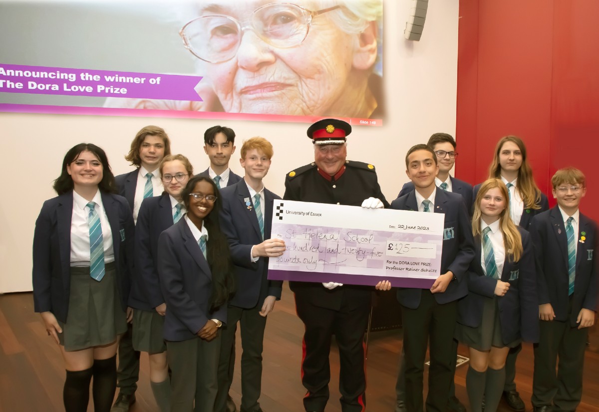 The St Helena School team receive their award from Deputy Lieutenant of Essex Simon Brice