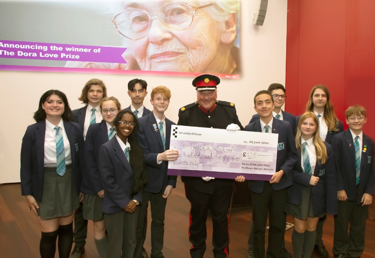 The St Helena School team receive their award from Deputy Lieutenant of Essex Simon Brice