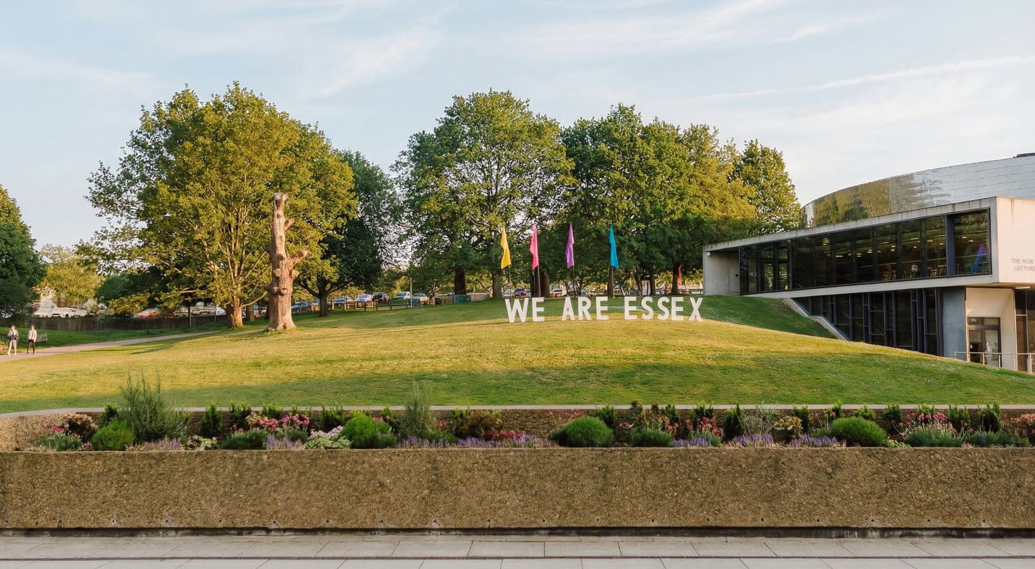 A giant 'WE ARE ESSEX' sign on grassed area outside the Ivor Crewe Lecture Hall