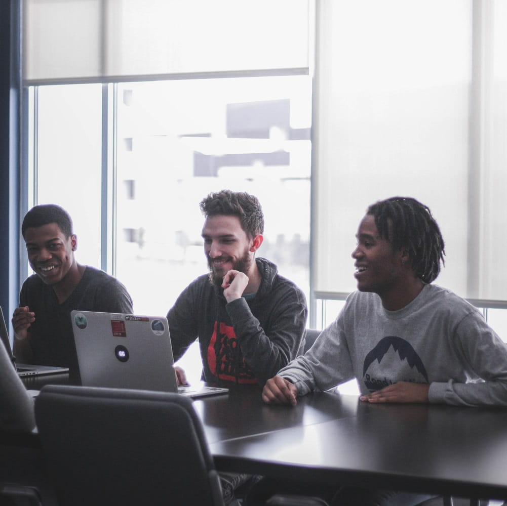 students working in group at laptop