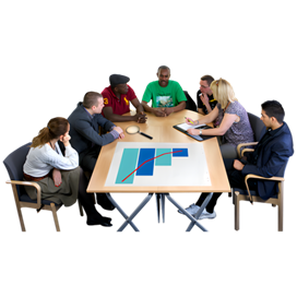 A group of people sitting around a table and talking. A printed out graph is on the table.