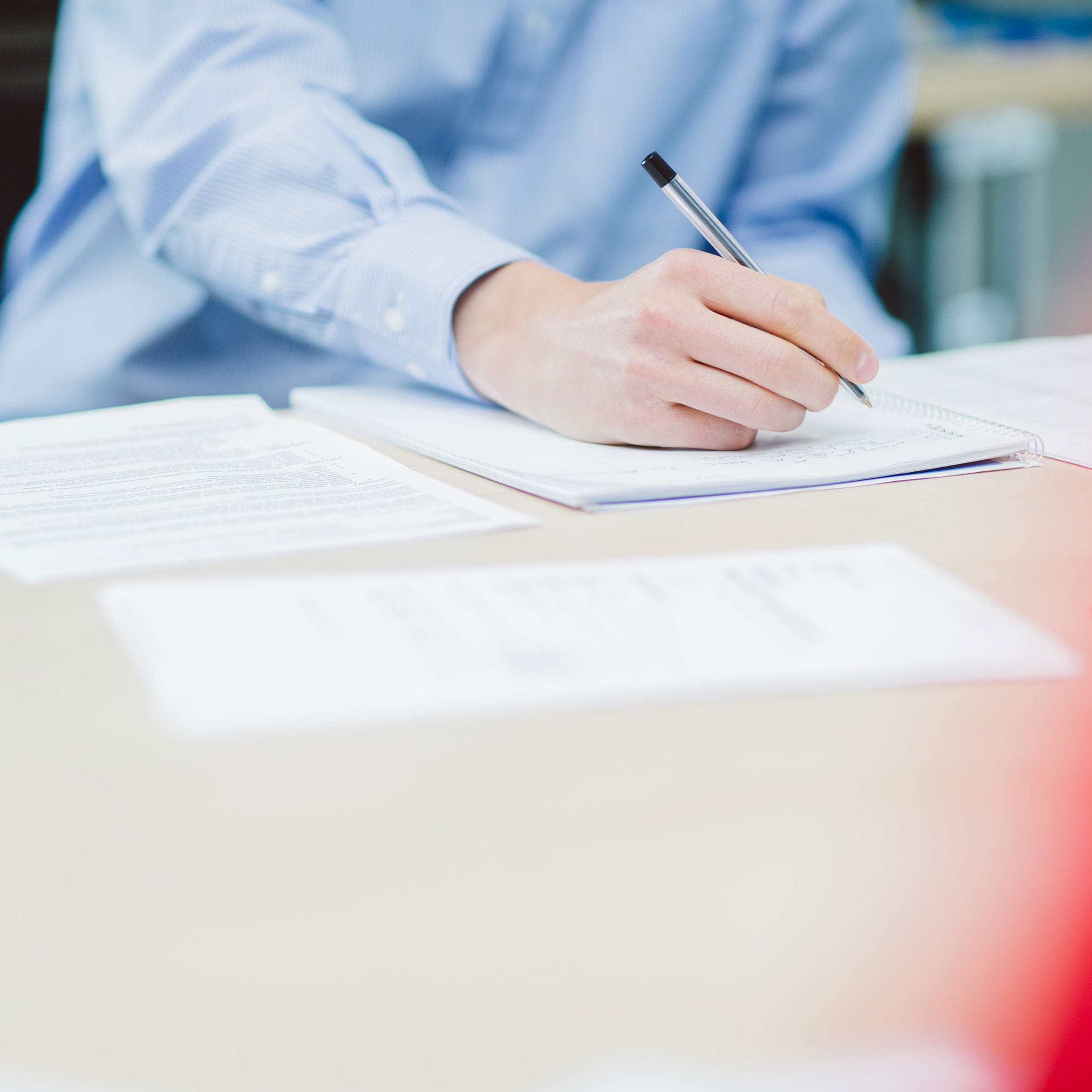 Writing on paper on a table