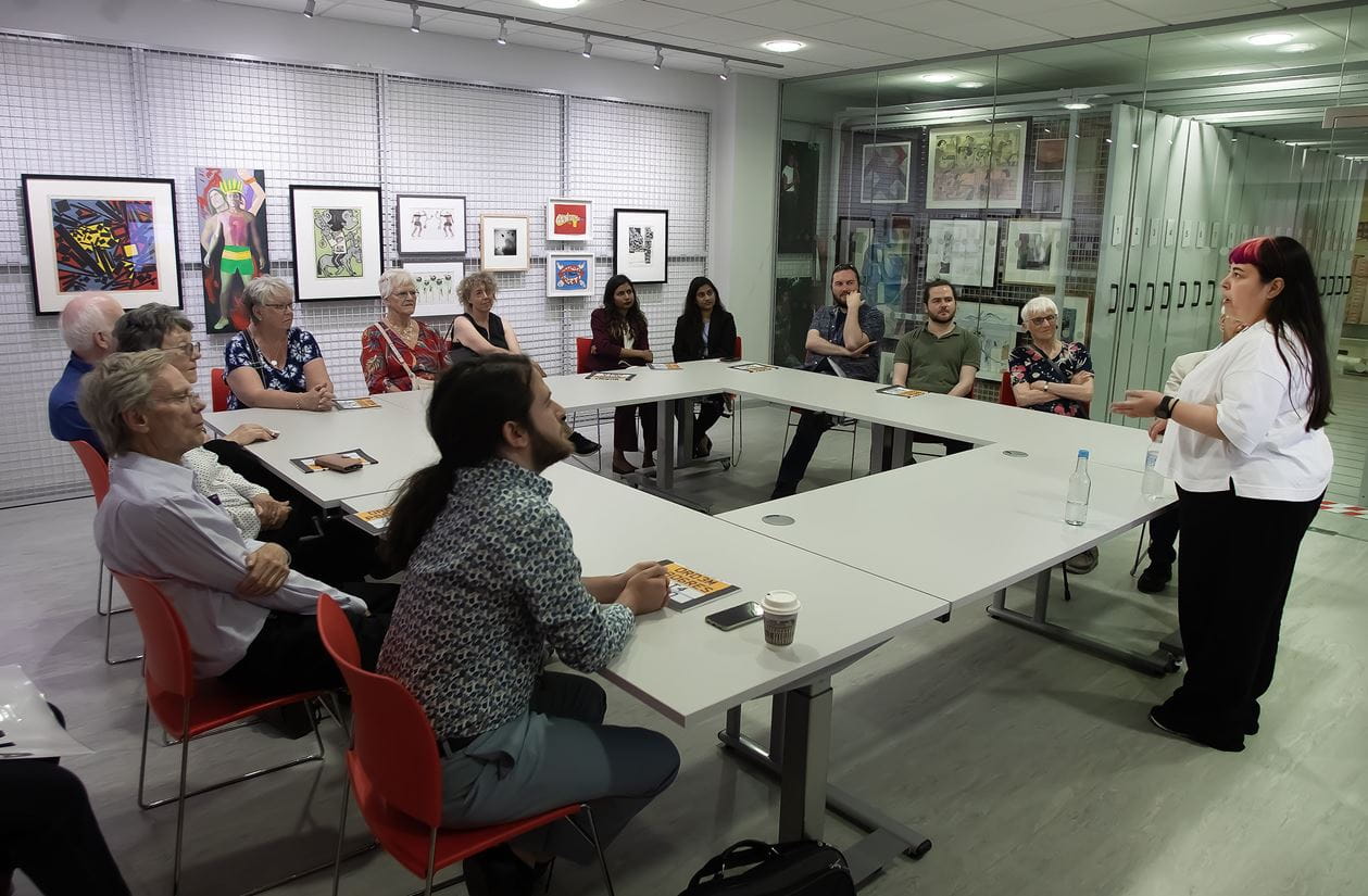 Court members and stakeholders listen to a talk on the University art collection