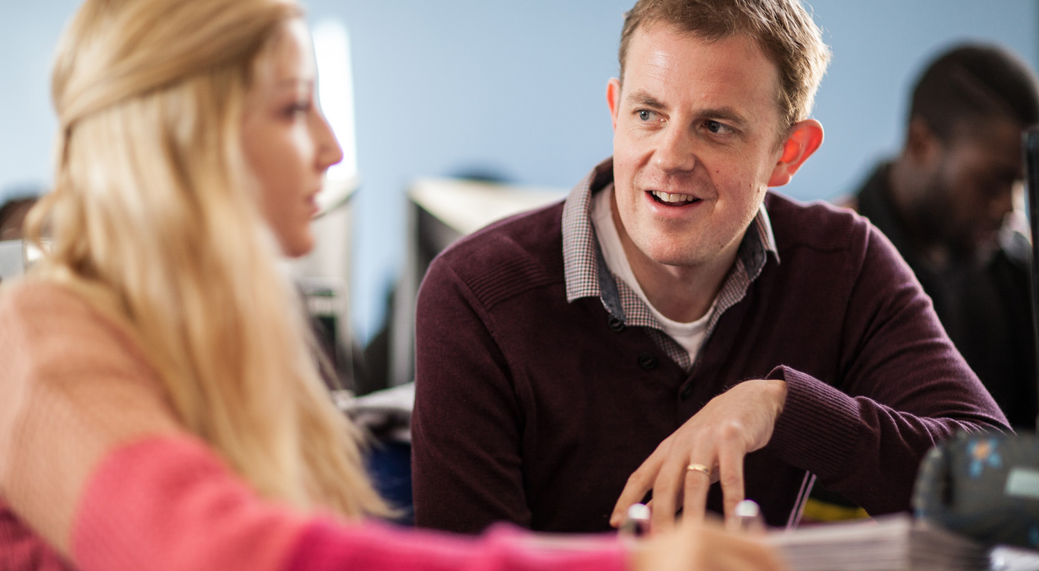Image of a student working with a member of staff