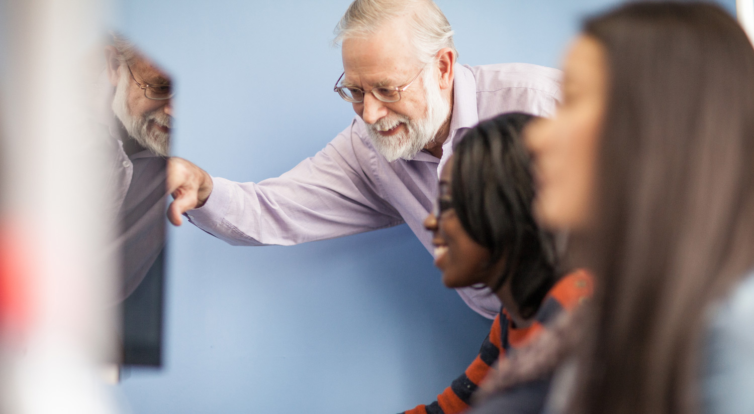 Image of a student working with a member of staff