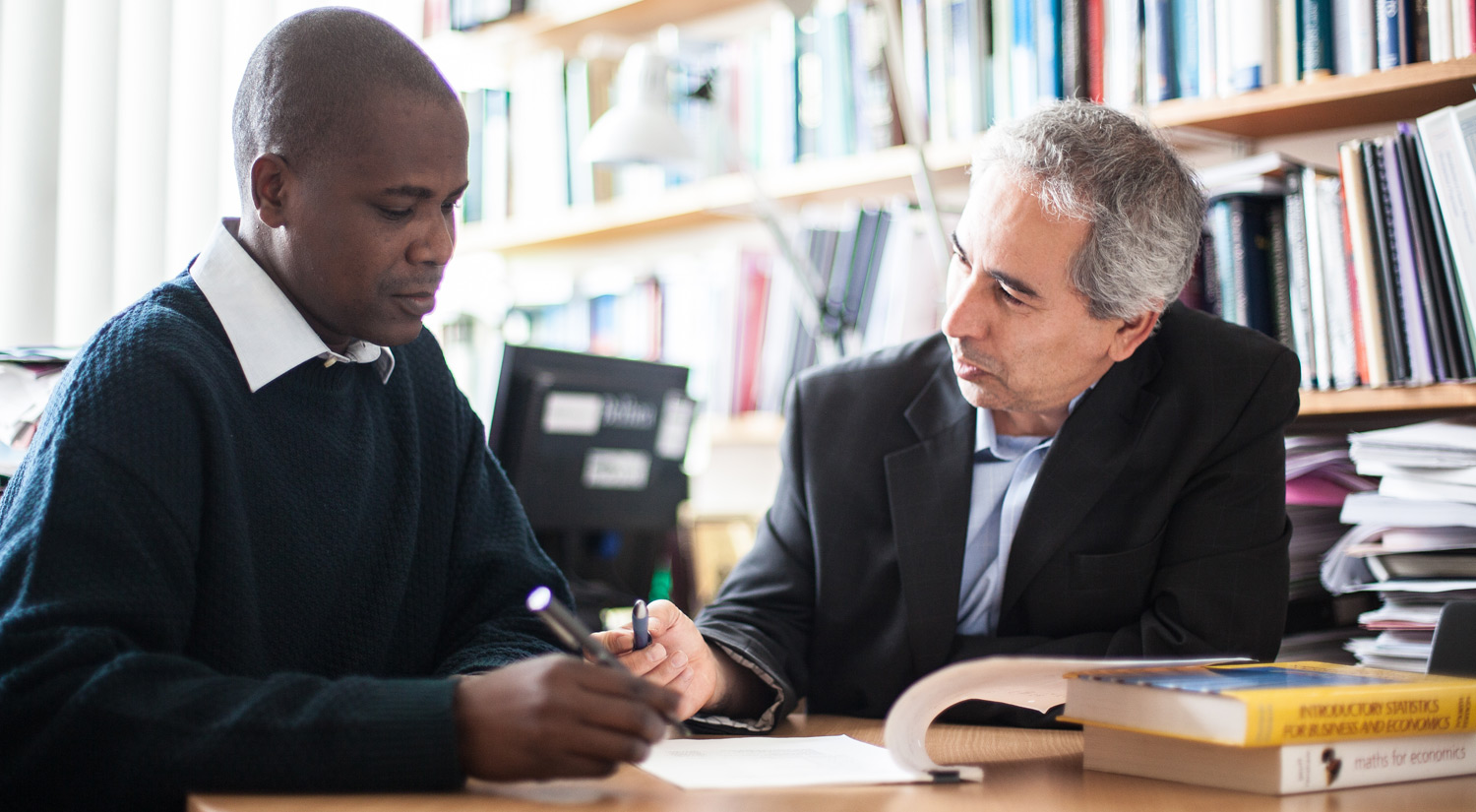 Image of a student working with a member of staff