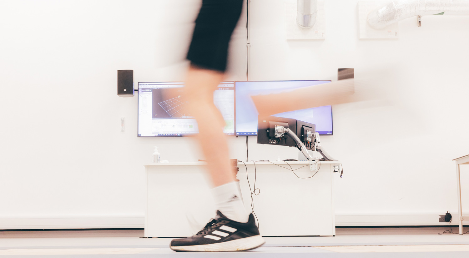 Student running across a pressure pad as part of a research experiment