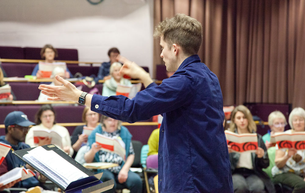 Ben Vonberg-Clark conduction University of Essex Choir in rehearsal