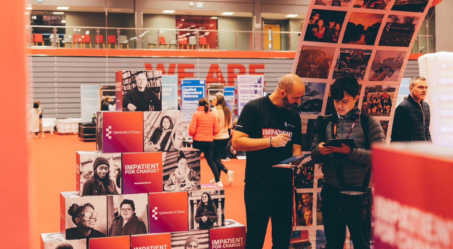 Two people looking at an iPad