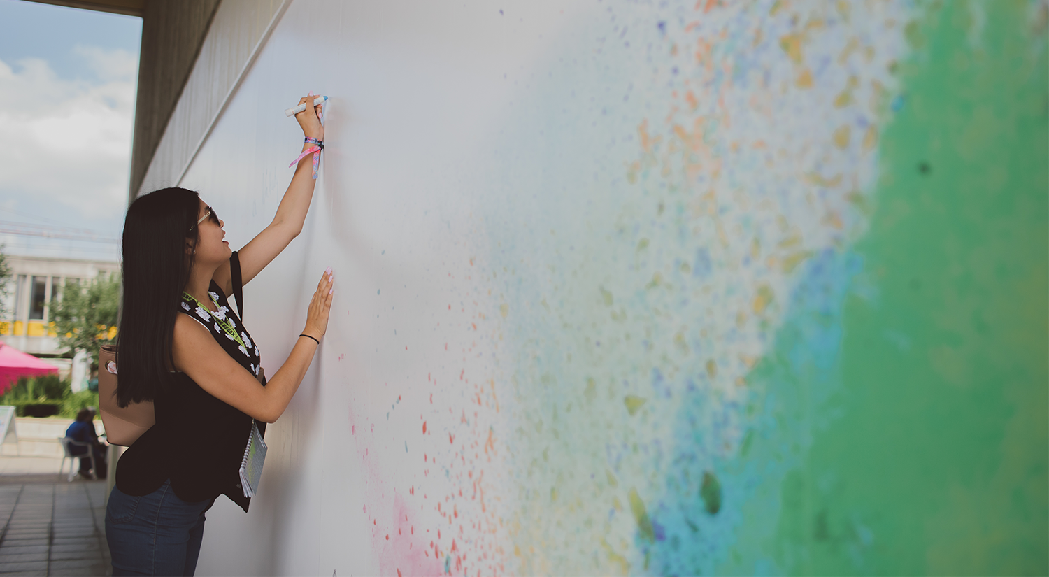 Person drawing on a big board