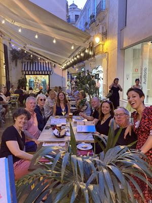 image of group of people at pavement cafe