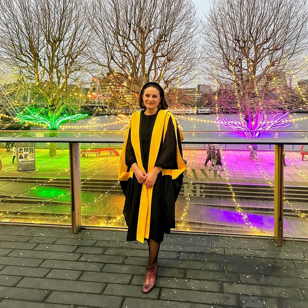 image of Megan Capon in graduation gowns