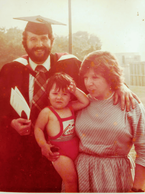 Mike Rose with his wife and son on his graduation day in 1982
