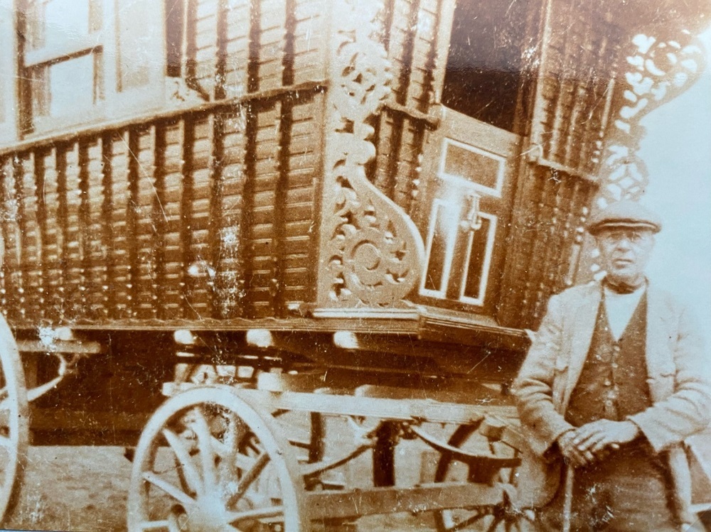 James Smith stands outside a wagon.